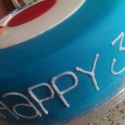 Text around the outside of the cake - 'Happy 30th Birthday'