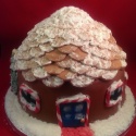 The body of the house was made from Christmas cake and the roof from sponge